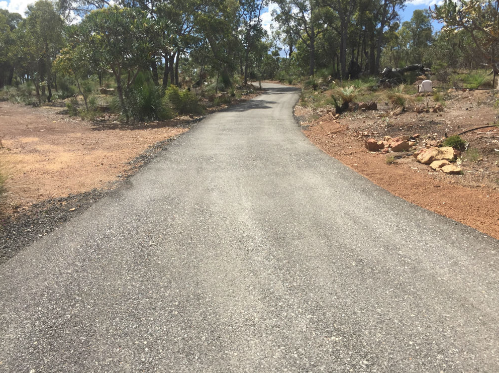 This is a photo of a hot spray & seal bitumen driveway which is in the process of being installed by _Hurstbridge Surfacing Solutions